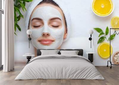 Close up view of a woman s face enjoying a rejuvenating spa procedure with a white clay facial mask emphasizing the concept of self care beauty and relaxation Wall mural