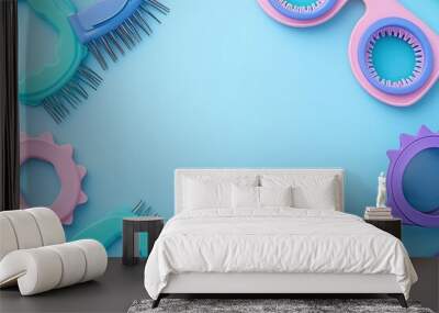 Colorful grooming tools arranged stylishly on a light blue background. Wall mural