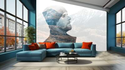 Double exposure of traveler man with beard against autumn mountains with snow. Wall mural