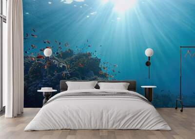 Life-giving sunlight underwater. Sun beams shinning underwater on the tropical coral reef. Ecosystem and environment conservatio Wall mural