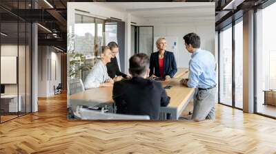 Businesswoman leading a meeting in office Wall mural