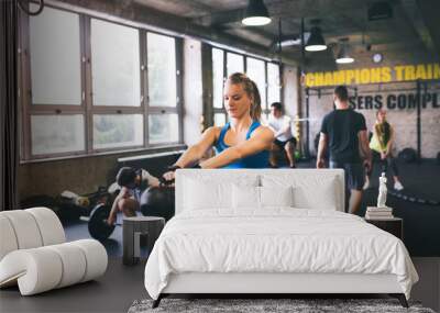 Group of young people exercising in gym Wall mural