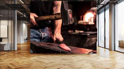 Knife maker at work, steel splinter during hammering damask steel Wall mural