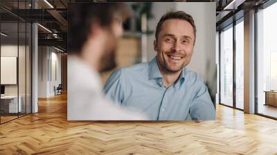 Two businessmen having a meeting in a coffee shop Wall mural