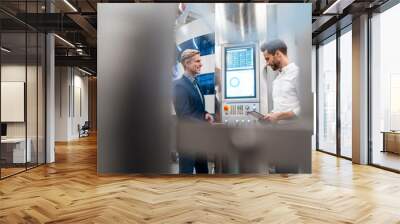 Two businessmen talking in a modern factory Wall mural