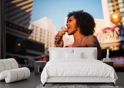 USA, Nevada, Las Vegas, happy young woman eating ice cream in the city Wall mural