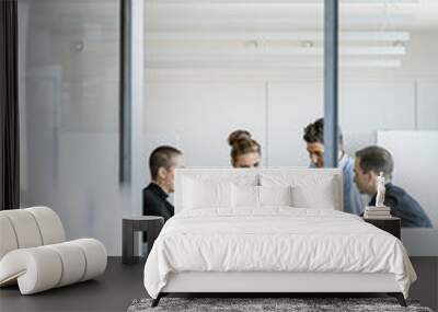 Young business people having a meeting in office Wall mural