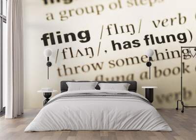 Close up of old English dictionary page with word fling Wall mural