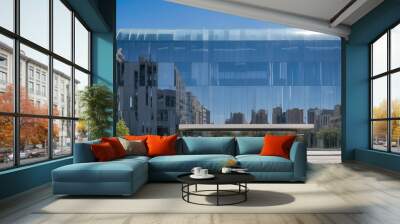 Modern office building with reflective glass panels, blending into the cityscape.- Wall mural