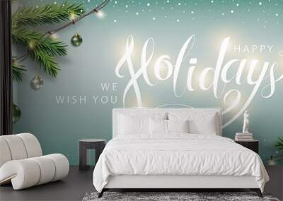 Happy Holidays Winter Background. Christmas lettering banner with sprig of spruce, Christmas tree toy, Xmas lights Garland on snowy backdrop. Vector Wall mural