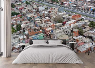 Photo of aerial view of La Villa 31 in Argentina, showcasing the city's skyline and the vibrant buildings Wall mural