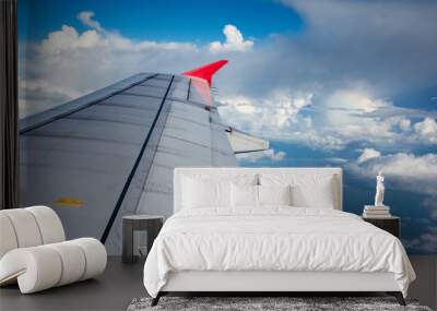 Looking through window aircraft during flight in wing with a nice blue sky. Wall mural