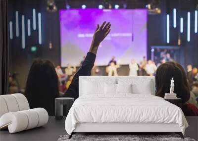 Hands in the air of people who praise God at church service Wall mural