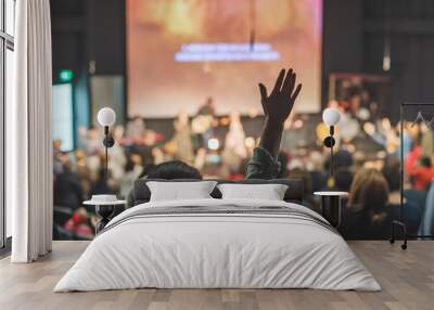 Hands in the air of people who praise God at church service Wall mural