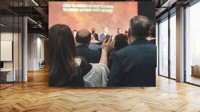 Hands in the air of people who praise God at church service Wall mural