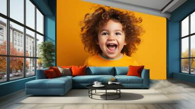 A happy toddler smiling. Isolated on a yellow orange plain background. Generative AI. Wall mural