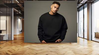 Isolated Portrait of a Fictional Male Model Wearing a Large Oversized Black Colored Sweatshirt on a Plain Blank Background. Generative AI. Wall mural