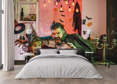 Father and son scare everyone on Halloween. Scary stories and games for kids on Halloween. Wall mural