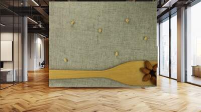 aabstract view of a wooden shovel with almonds Wall mural