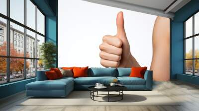 Closeup of female hand showing thumbs up sign against white background Wall mural