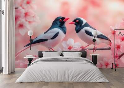 Two Red-billed Leiothrix Birds Perched on a Branch of Pink Blossoms Wall mural