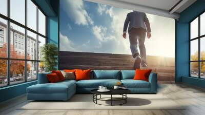 Ambitions concept with businessman climbing stairs - Personal development and career growth concepts. Wall mural