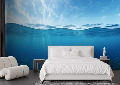 Split view horizon of blue sky with clouds and sunlight and blue underwater ocean. Breathtaking Oceanic Panorama - with copy space to insert ads. Wall mural