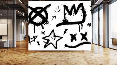 Set of black graffiti spray. Collection of arrow, skull, heart and symbols with spray texture and stencil pattern. Elements on white background for banner, decoration, street art and ads. Wall mural