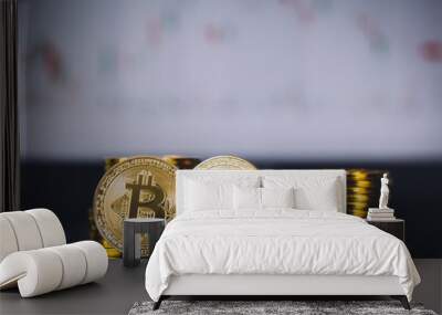 Bitcoin coins pile and two bit coins sitting in front with candle stick graph chart digital background. Concept of Bitcoin and virtual currency and blockchain technology Wall mural