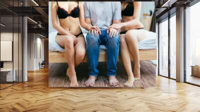 Couple having complicated affair and love triangle in bedroom Wall mural