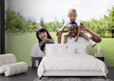 Happy diverse and mixed race family group photo in the park Wall mural