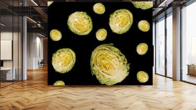 Culinary background. Halfs of cut white cabbage on black backgro Wall mural