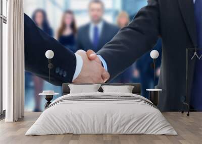 closeup of a business hand shake between two colleagues Wall mural