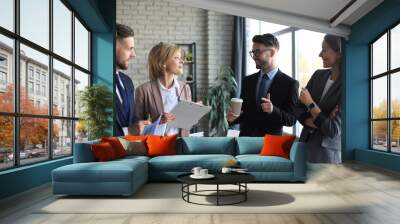 Group of business partners discussing ideas and planning work in office. Wall mural