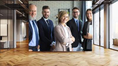 Group of businesspeople standing together in office. Wall mural