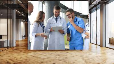 Group of doctors standing at the medical office. Wall mural