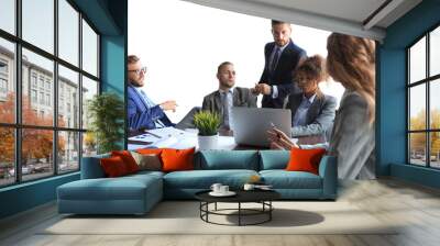 Group of modern business people in formalwear discussing business and smiling while sitting in the office Wall mural