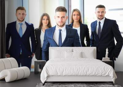 Group portrait of a professional business team looking confidently at camera Wall mural