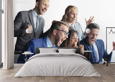 Happy business people laugh near laptop on a transparent background. Successful team coworkers joke and have fun together at work. Wall mural