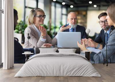 Portrait of a positive business employees at an office business meeting. Wall mural