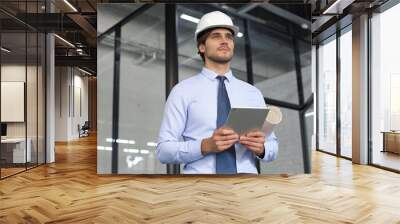 Shot of a engineer using a digital tablet on a construction site. Wall mural