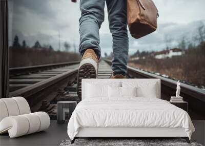 Traveler with bags walking on railroad track Wall mural