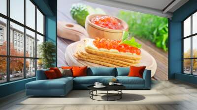 toasts with red caviar on board Wall mural