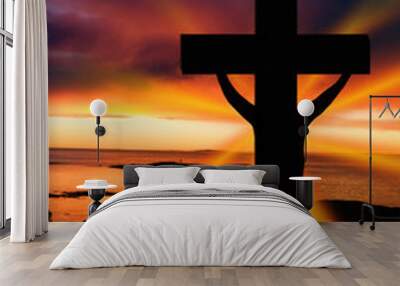 a cross at sundown on the ocean Wall mural