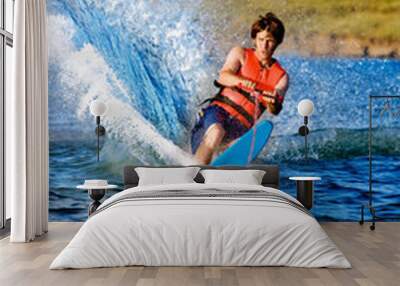 A man water skiing on a lake Wall mural