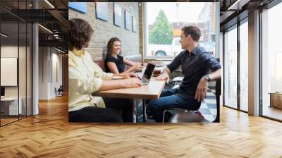 Friends Spending Leisure Time In Cafe Wall mural