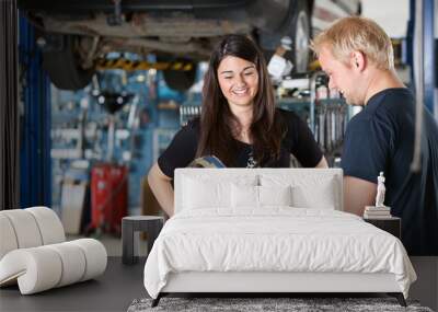 happy female customer at mechanic Wall mural