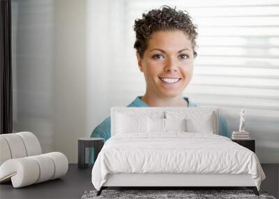 Happy Female Nurse In Scrubs Wall mural