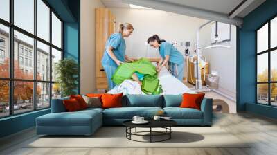 Nurses Preparing Patient Before Transferring Him On Hydraulic Li Wall mural