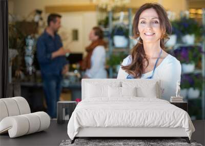 Portrait Of Smiling Florist At Flower Shop Wall mural